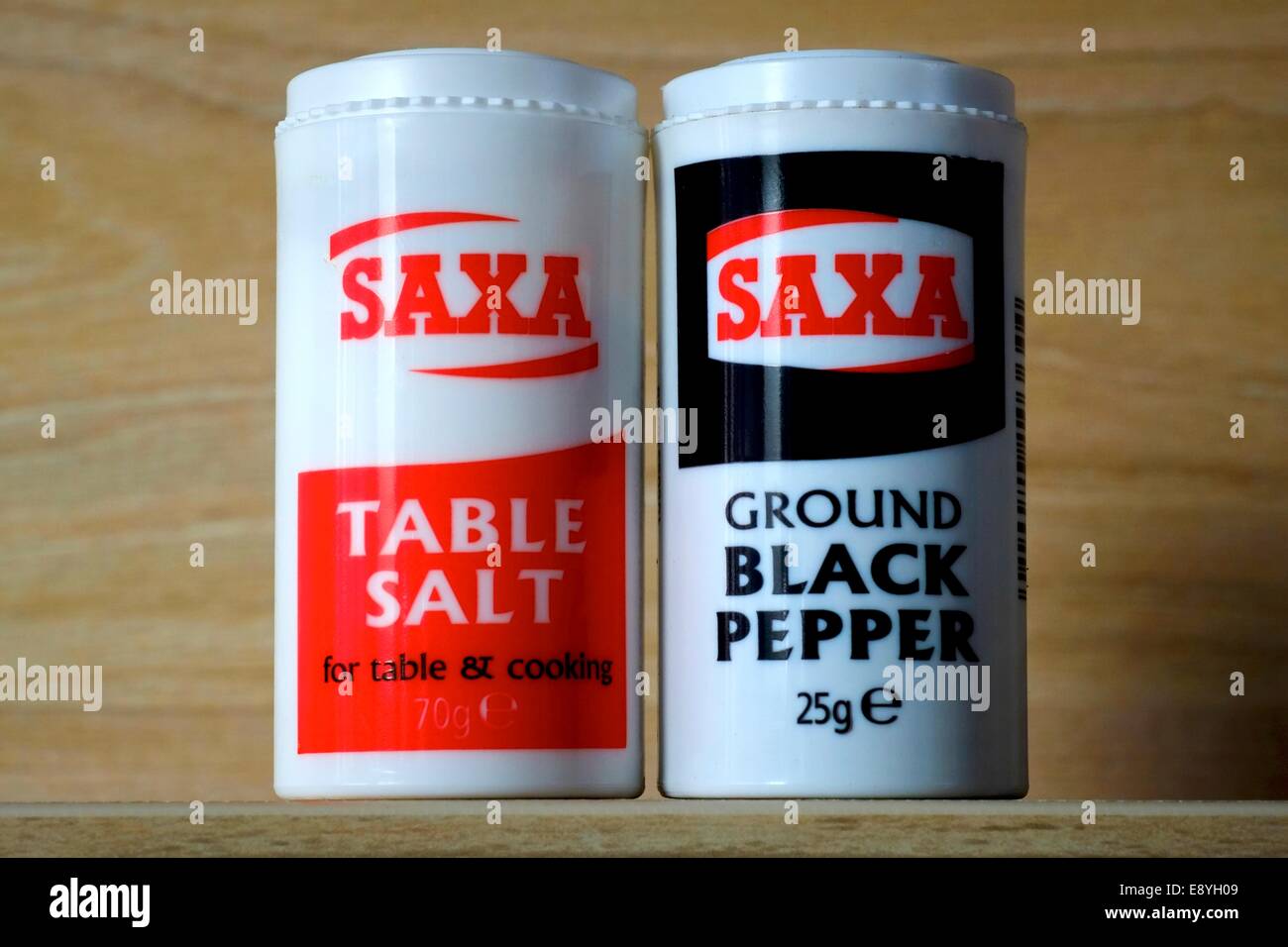 Small Saxa table salt and black pepper dispensers Stock Photo