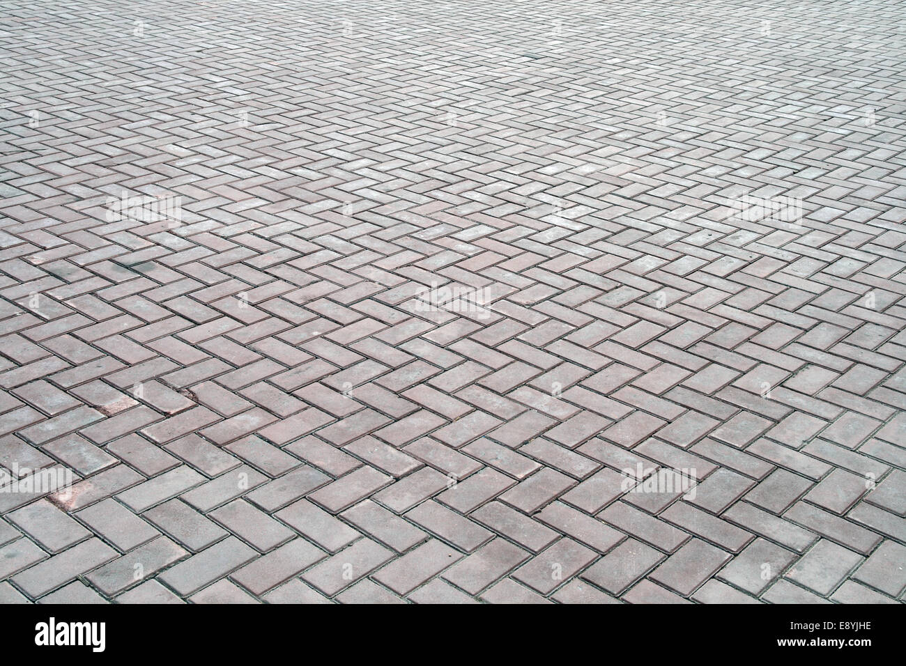 Roadway lined with concrete tiles Stock Photo