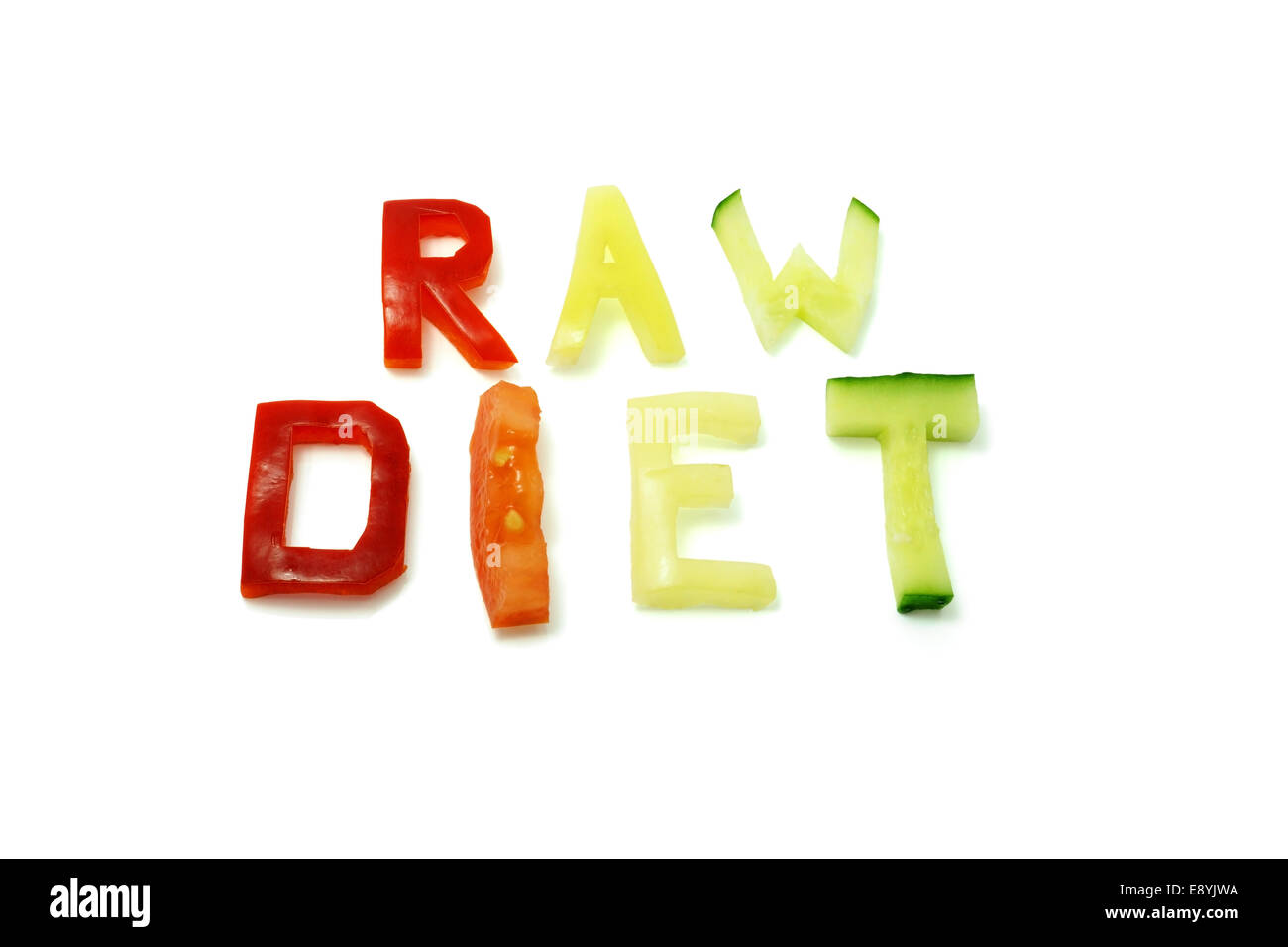 words raw diet composed of slices of different vegetables Stock Photo