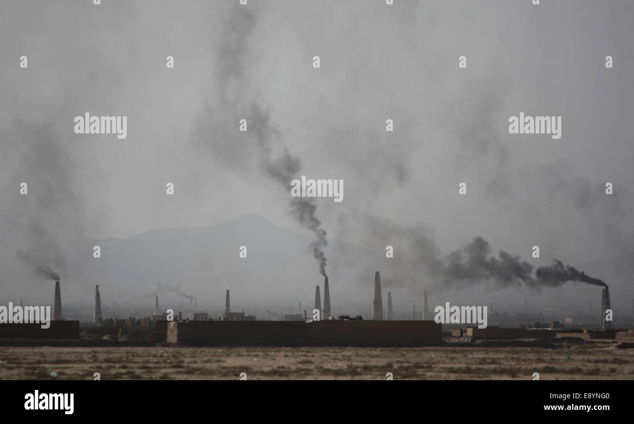 Kabul, Afghanistan. 16th Oct, 2014. Smoke rises from the chimneys of a brick factory on the outskirt of Kabul, Afghanistan, Oct. 16, 2014. © Ahmad Massoud/Xinhua/Alamy Live News Stock Photo