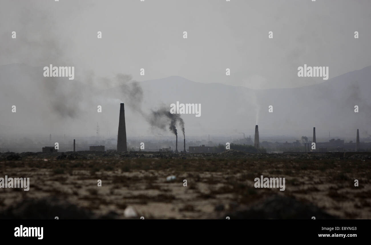 Kabul, Afghanistan. 16th Oct, 2014. Smoke rises from the chimneys of a brick factory on the outskirt of Kabul, Afghanistan, Oct. 16, 2014. © Ahmad Massoud/Xinhua/Alamy Live News Stock Photo