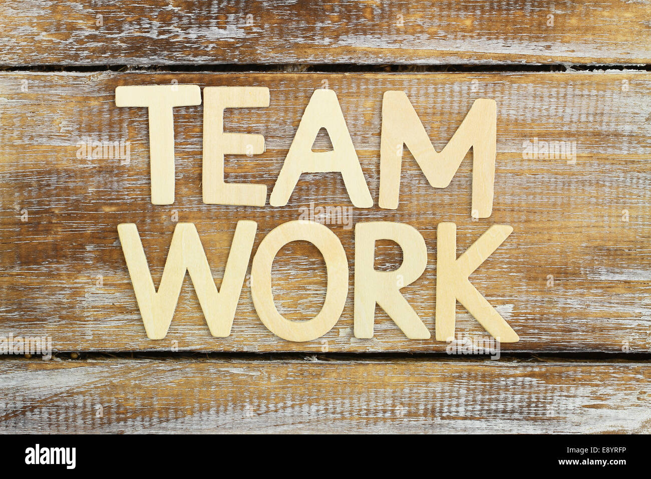 'Team work' written with wooden letters on rustic wooden surface Stock Photo