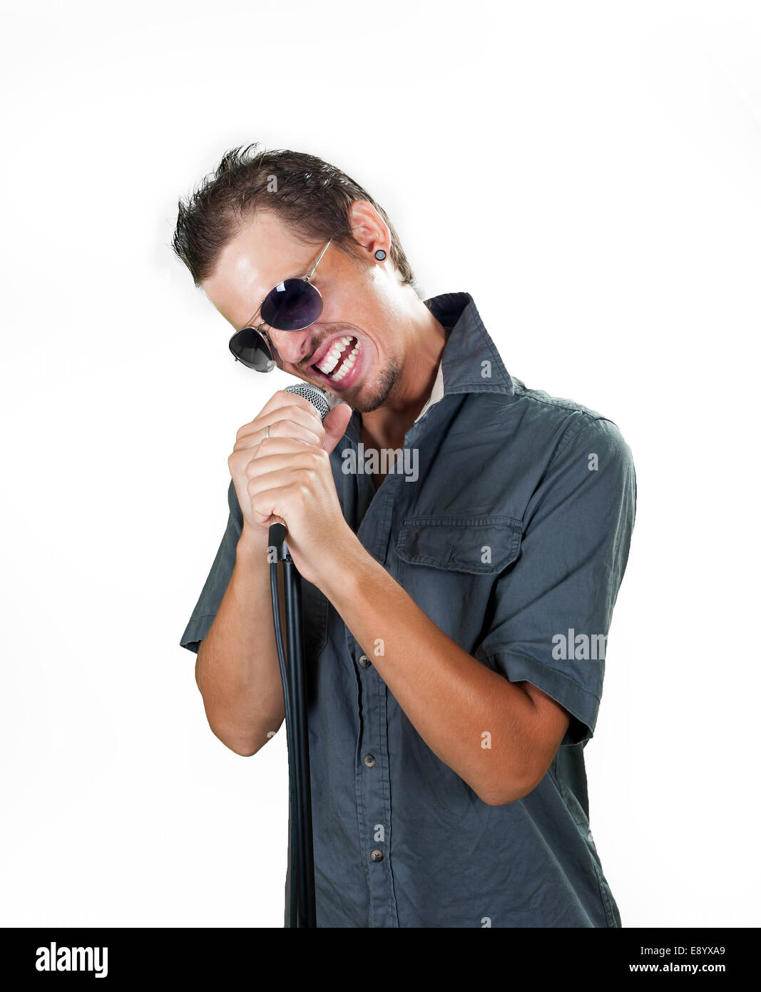 Young european rock singer on the white background Stock Photo