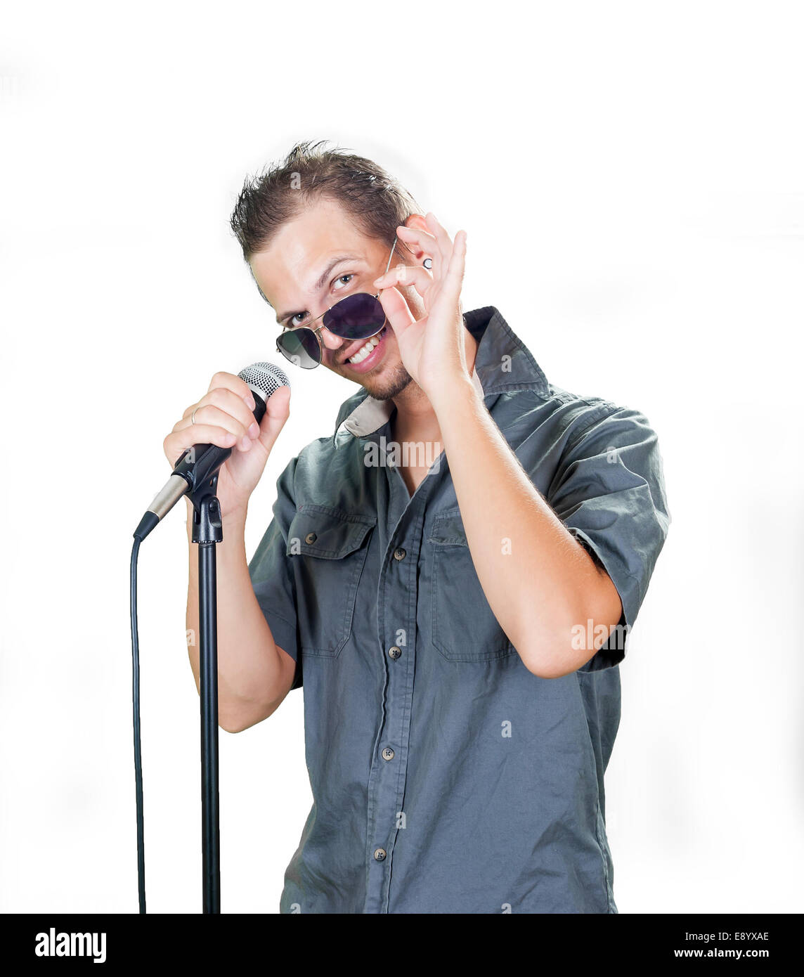Handsome caucasian singer on the white background Stock Photo
