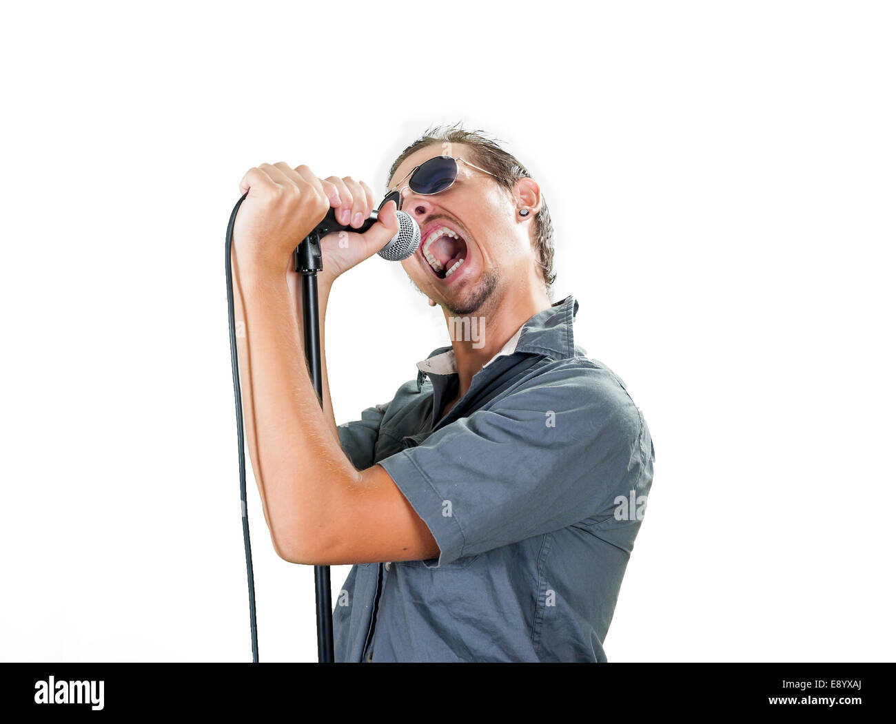 Young european rock singer on the white background Stock Photo