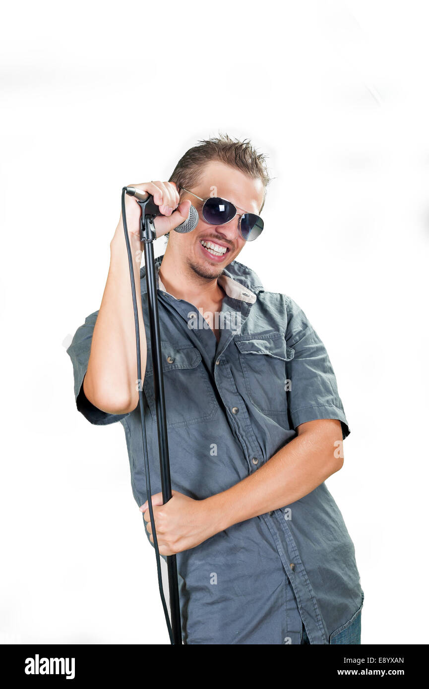 Young caucasian singer wearing sunglasses on the white background Stock Photo