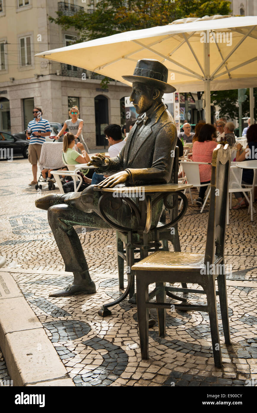 Portugal Lisbon Rua Garrett Road Statue sculpture bronze seated man at  table chairs by Cafe Brasileira patterned cobble stones Stock Photo - Alamy