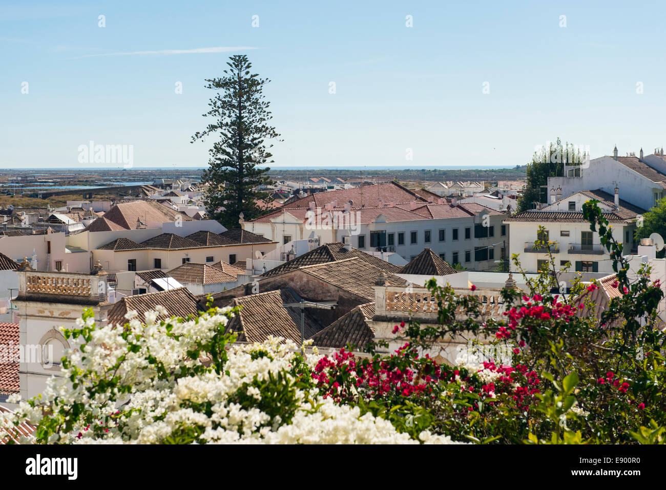 Portugal Algarve Tavira late Bronze Age port rebuilt 18th c century panorama landscape old town houses roofs roof tree trees flowers Stock Photo