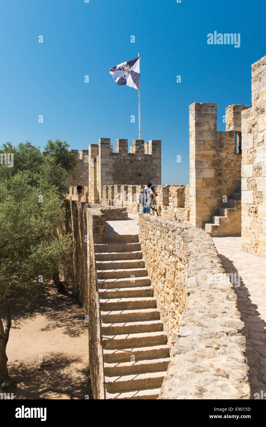 Portugal Castle Castelo de Sao Jorge battlements stairs staircase Lisbon city coat of arms on black white gyronny flag flagpole Stock Photo