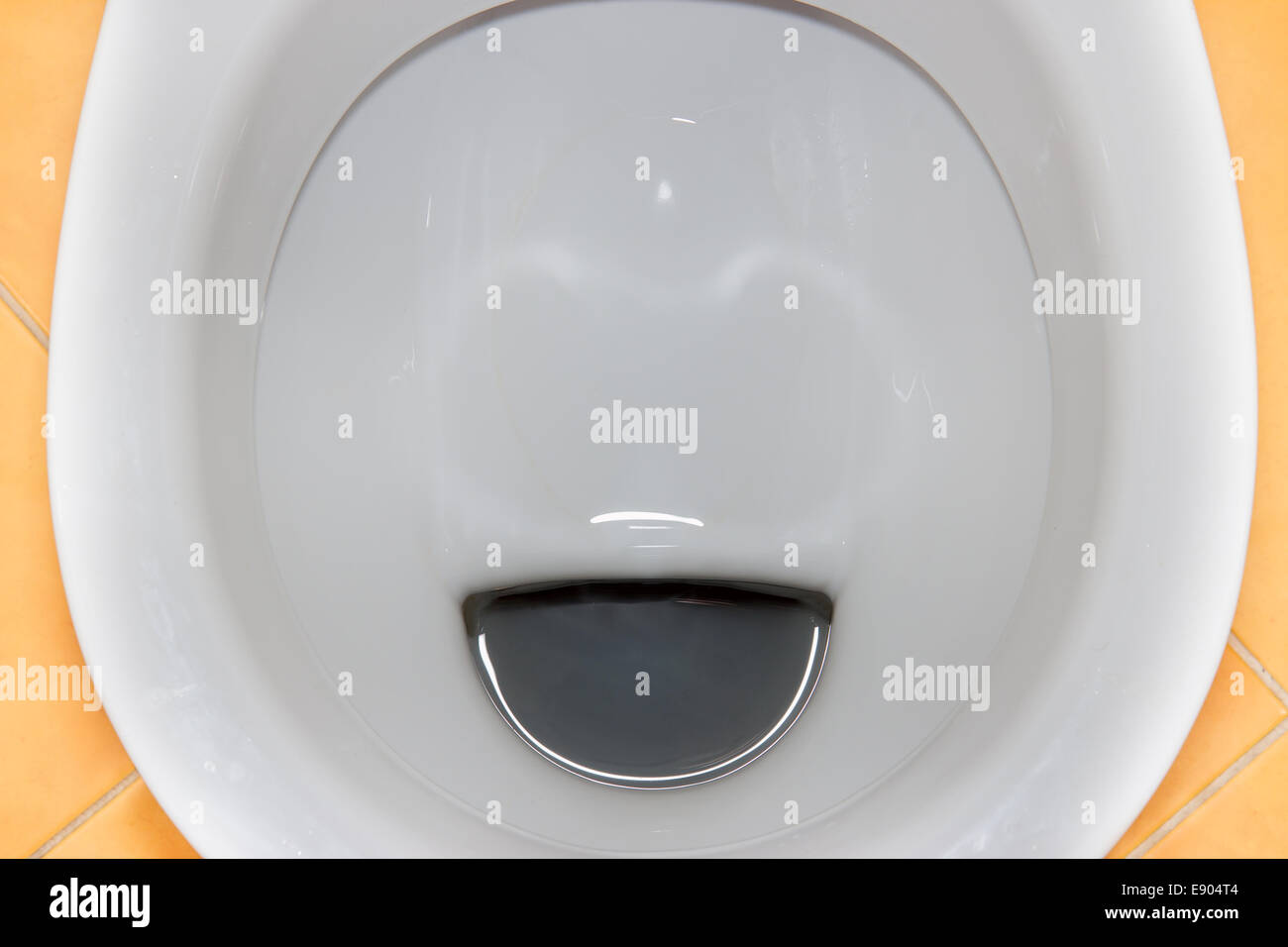 Top view of a flushing toilet Stock Photo