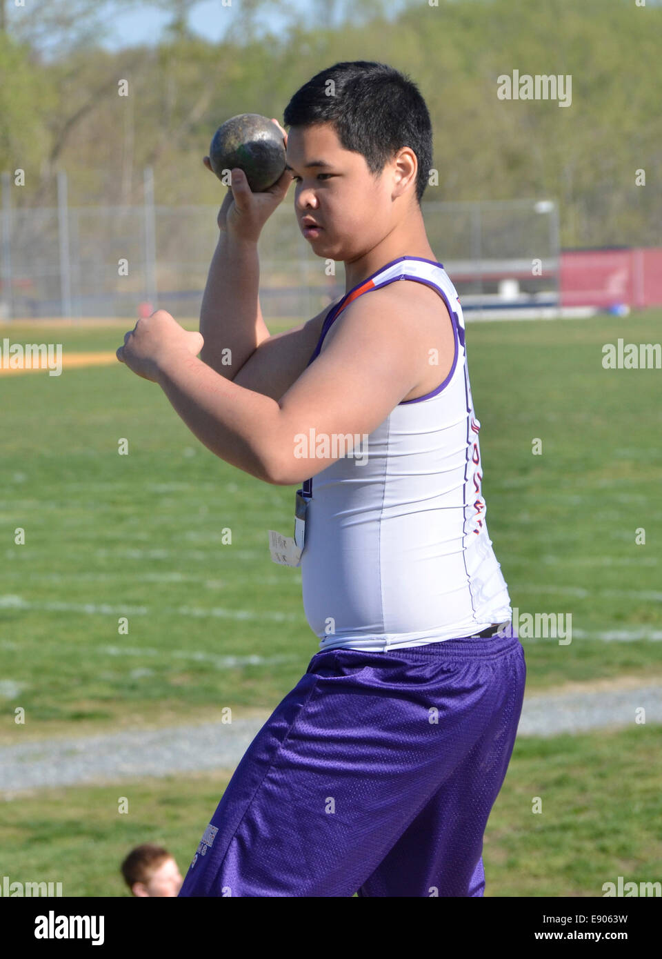 teen prepares to throw a shot put during a high school  track and field event in  Maryland Stock Photo