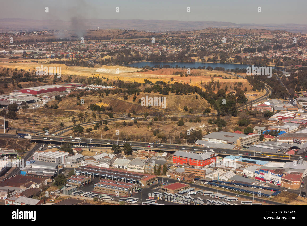 JOHANNESBURG, SOUTH AFRICA - Buildings in southern section of the central business district, and mounds of gold mine tailings. Stock Photo