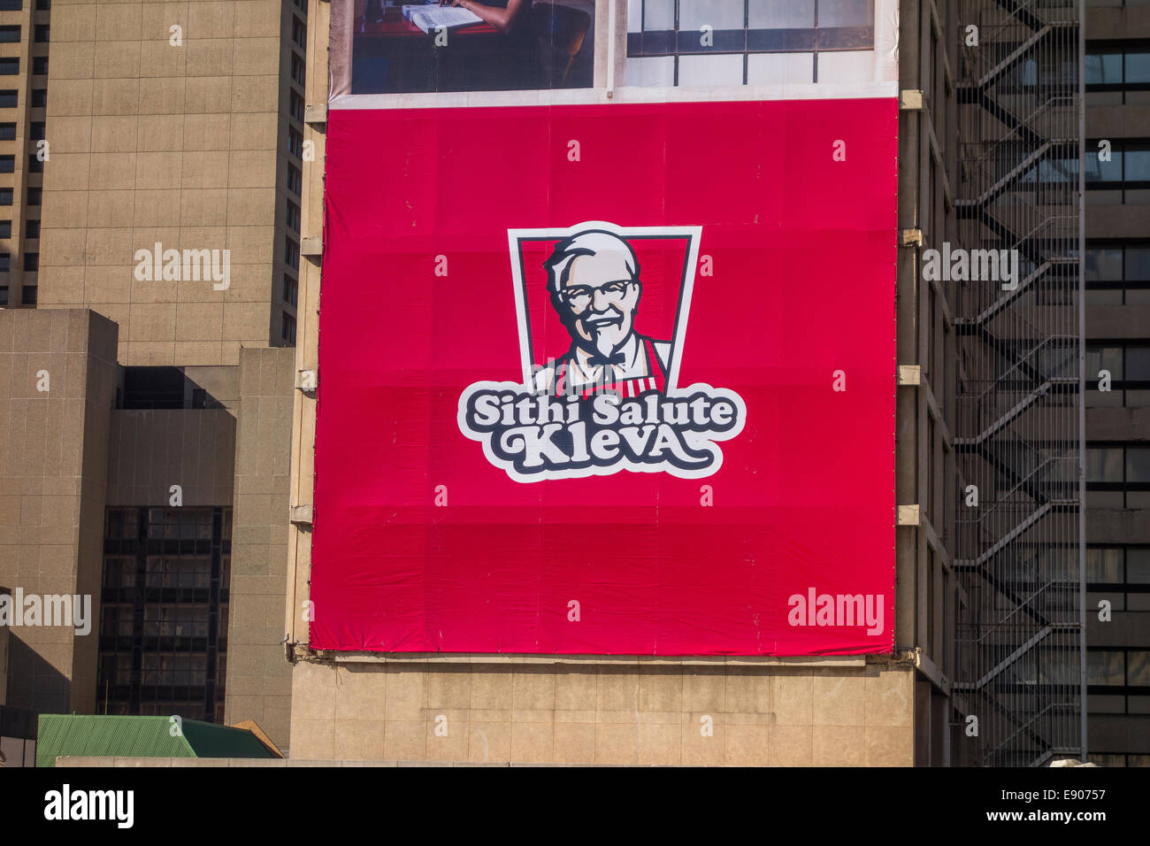 JOHANNESBURG, SOUTH AFRICA - Billboard advertisement for KFC Kentucky Fried Chicken, in Gandhi Square, in downtown city center. Stock Photo