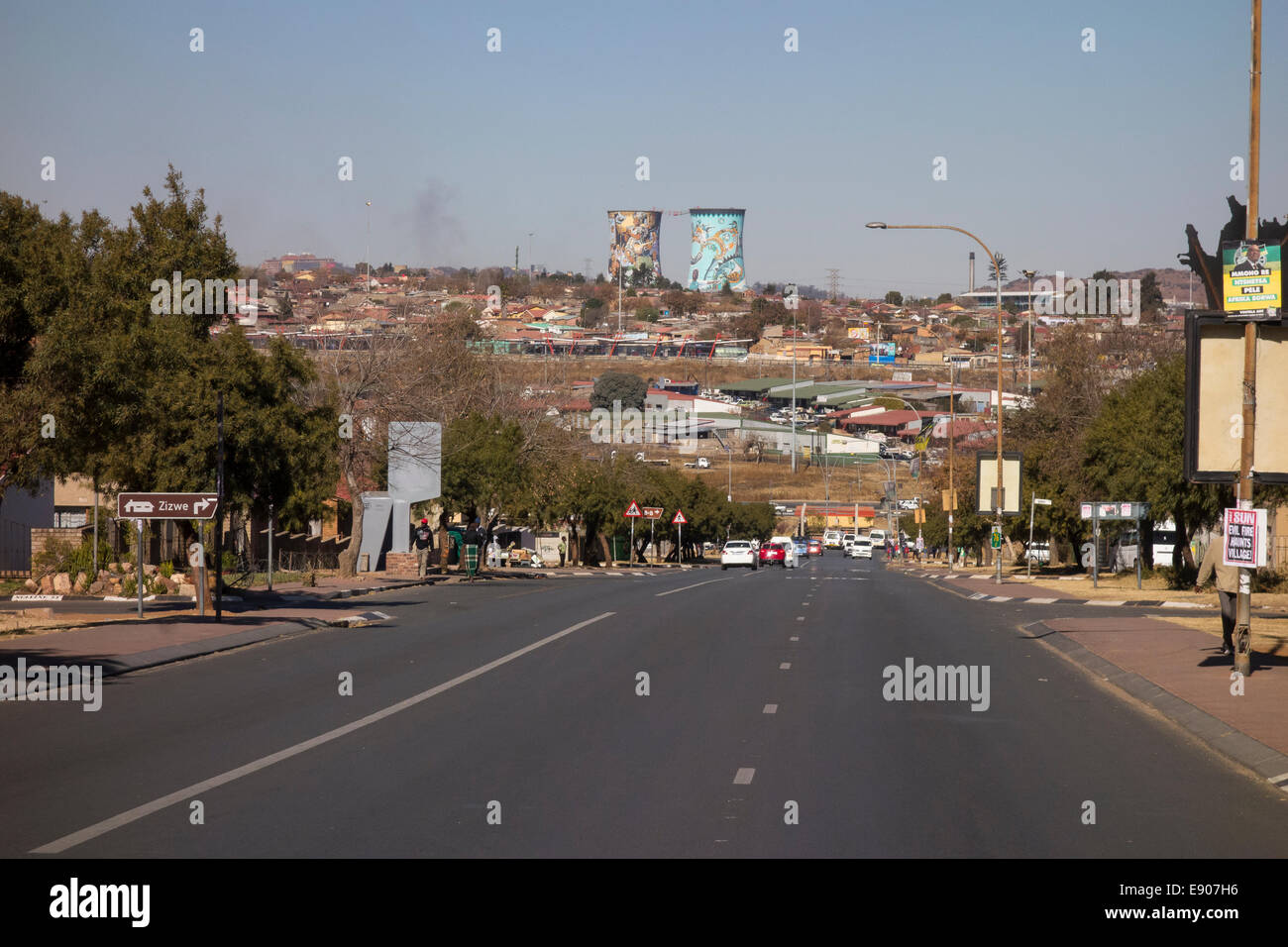 SOWETO, JOHANNESBURG, SOUTH AFRICA - Street scene, with Orlando Cooling Towers in distance. Stock Photo