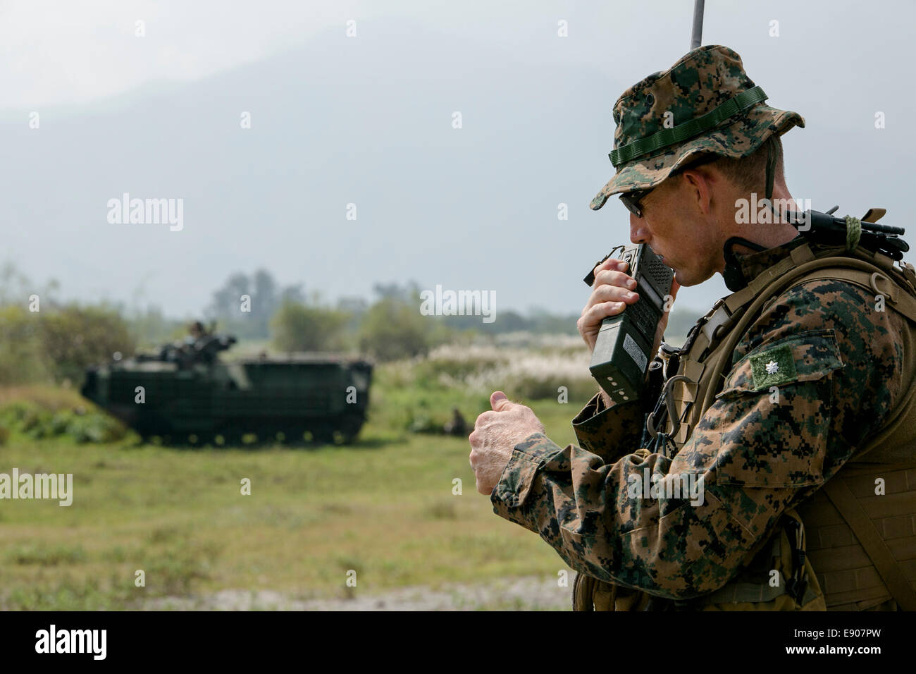 U.S. Marine Corps Lt. Col. Robert C. Rice, the commanding officer of Battalion Landing Team, 3rd Battalion, 5th Marine Regiment, 31st Marine Expeditionary Unit, communicates with his unit and Philippine marines during a mechanized assault as part of Amphi Stock Photo