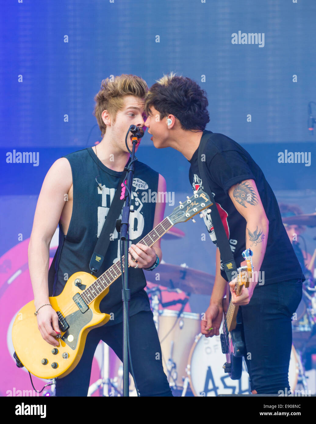Rock band 5 Seconds of Summer performs on stage at the 2014 iHeartRadio Music Festival Village in Las Vegas. Stock Photo