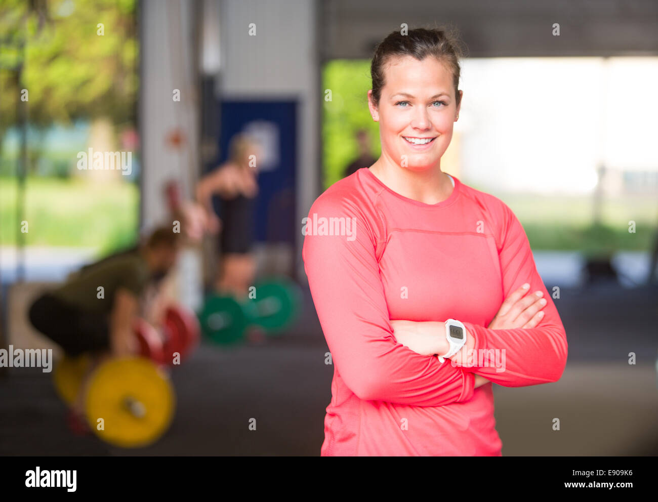 Female coach arms crossed hi-res stock photography and images - Alamy