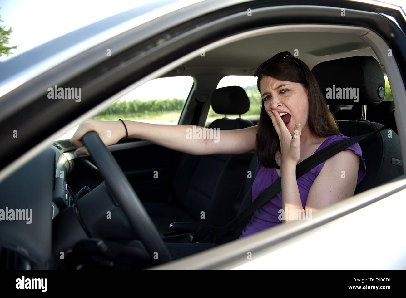 Tired at the steering wheel Stock Photo