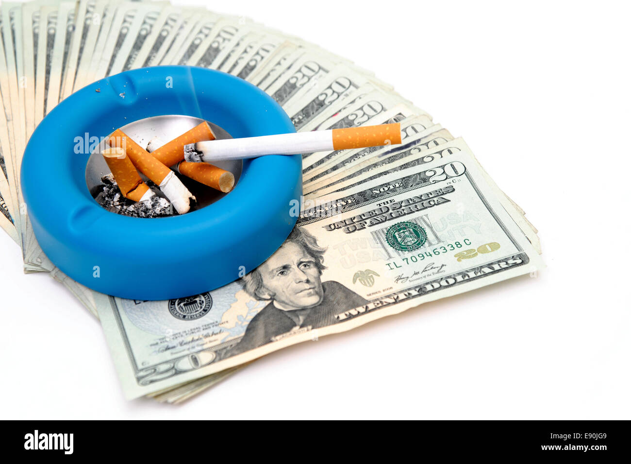 Cigarettes - Money Up In Smoke Stock Photo