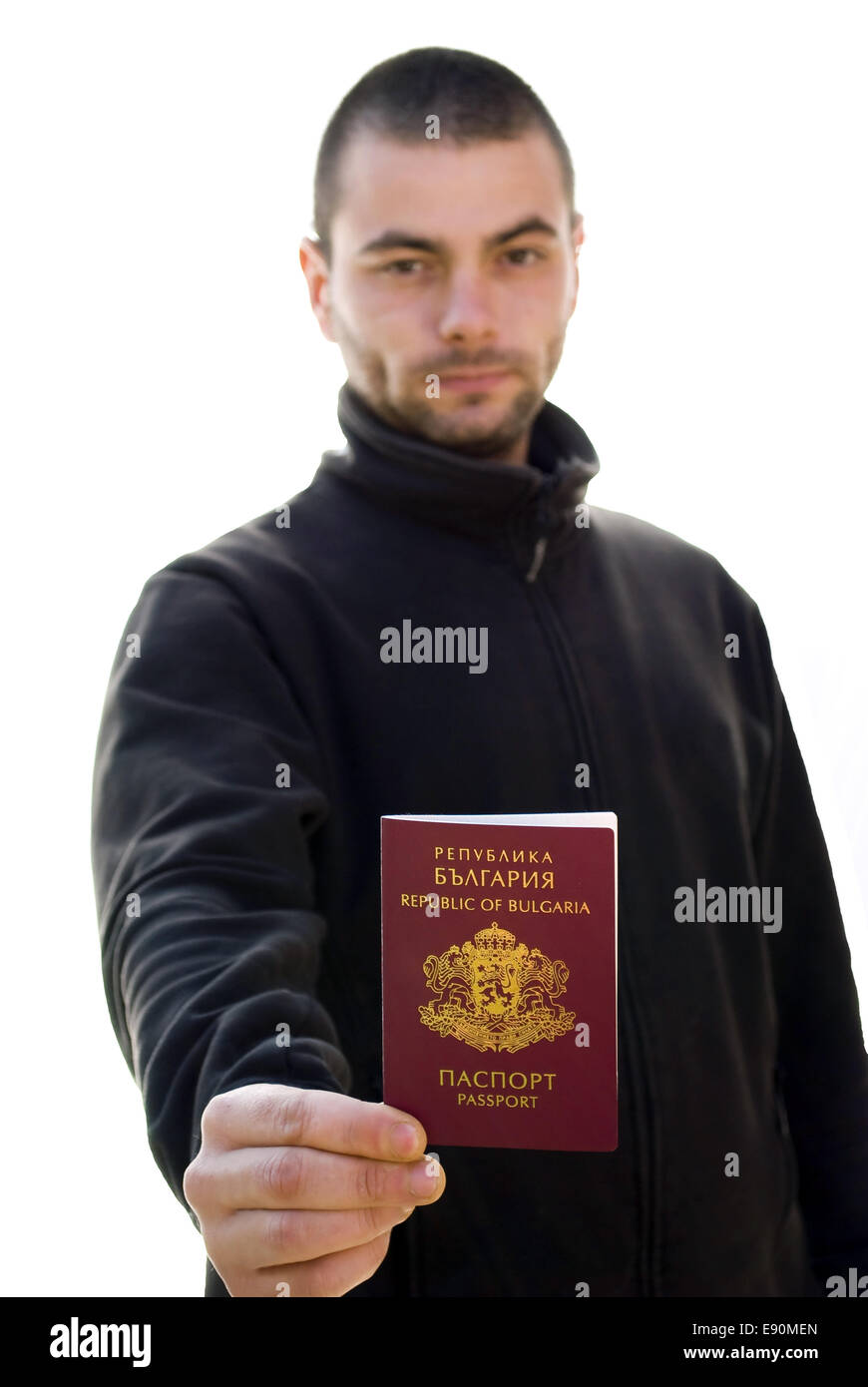 young man holding passport Stock Photo Alamy
