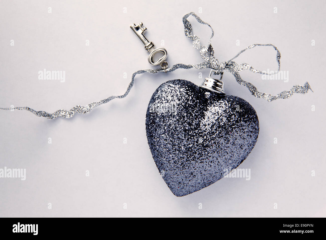 Beautiful Heart With Key On Silver Ribbon Stock Photo - Alamy