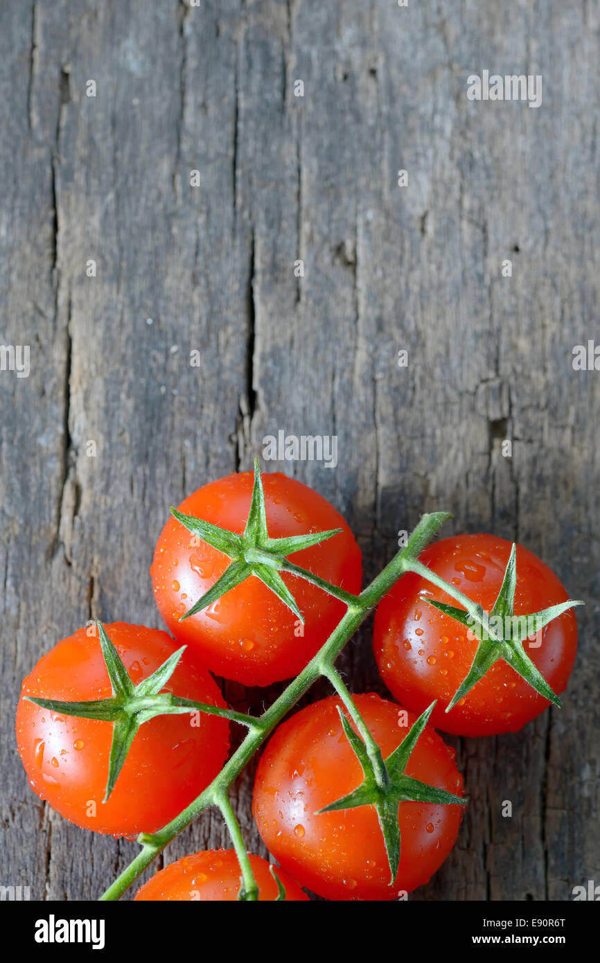 fresh, ripe cherry tomatoes on wood Stock Photo - Alamy