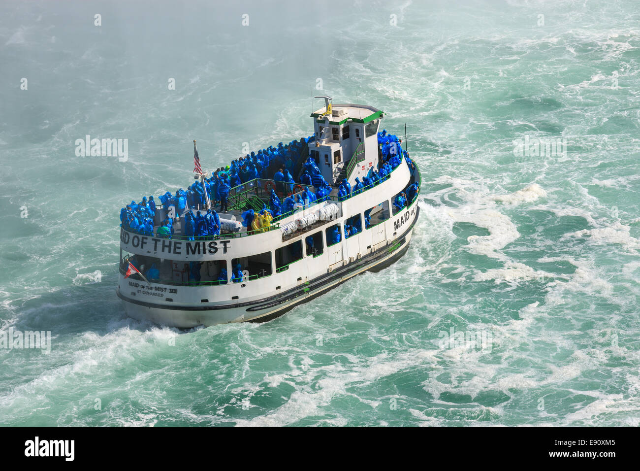 The Maid of the Mist loaded with tourists entering the Horseshoe Falls, part of the Niagara Falls, Ontario, Canada. Stock Photo