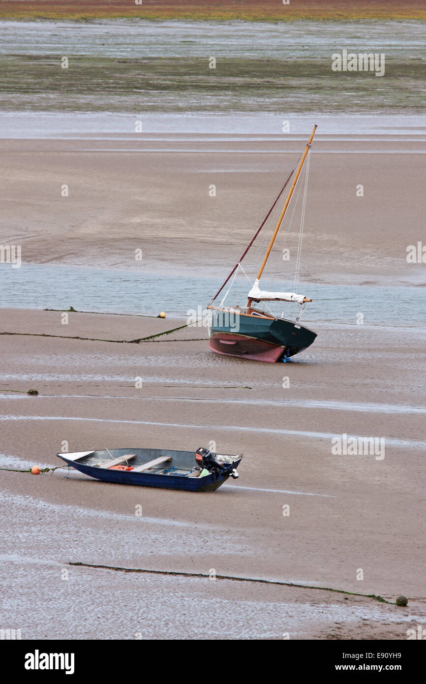 Sail boat and dinghy marooned at low tide in the Torridge estuary in