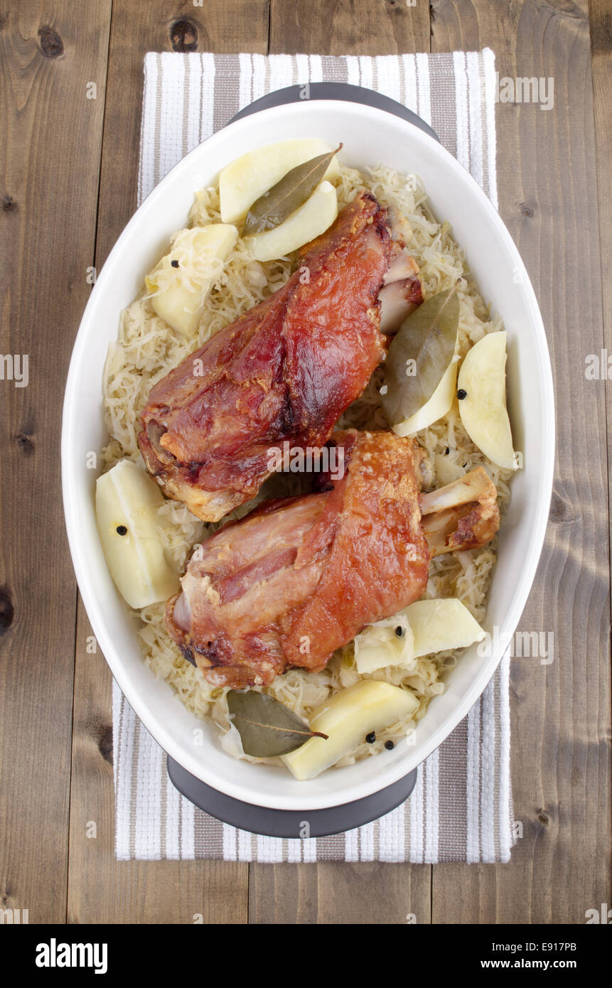 casserole with potato, pickled cabbage, bay leaf and knuckle of pork Stock Photo