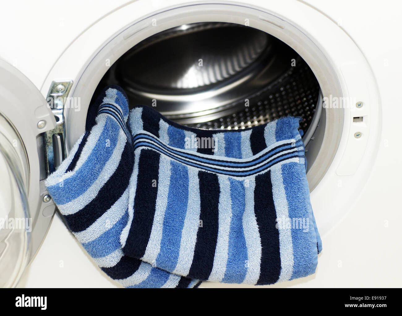 Washing Machine with Towels Stock Photo Alamy