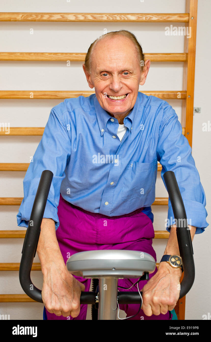 Senior on Ergometer Stock Photo