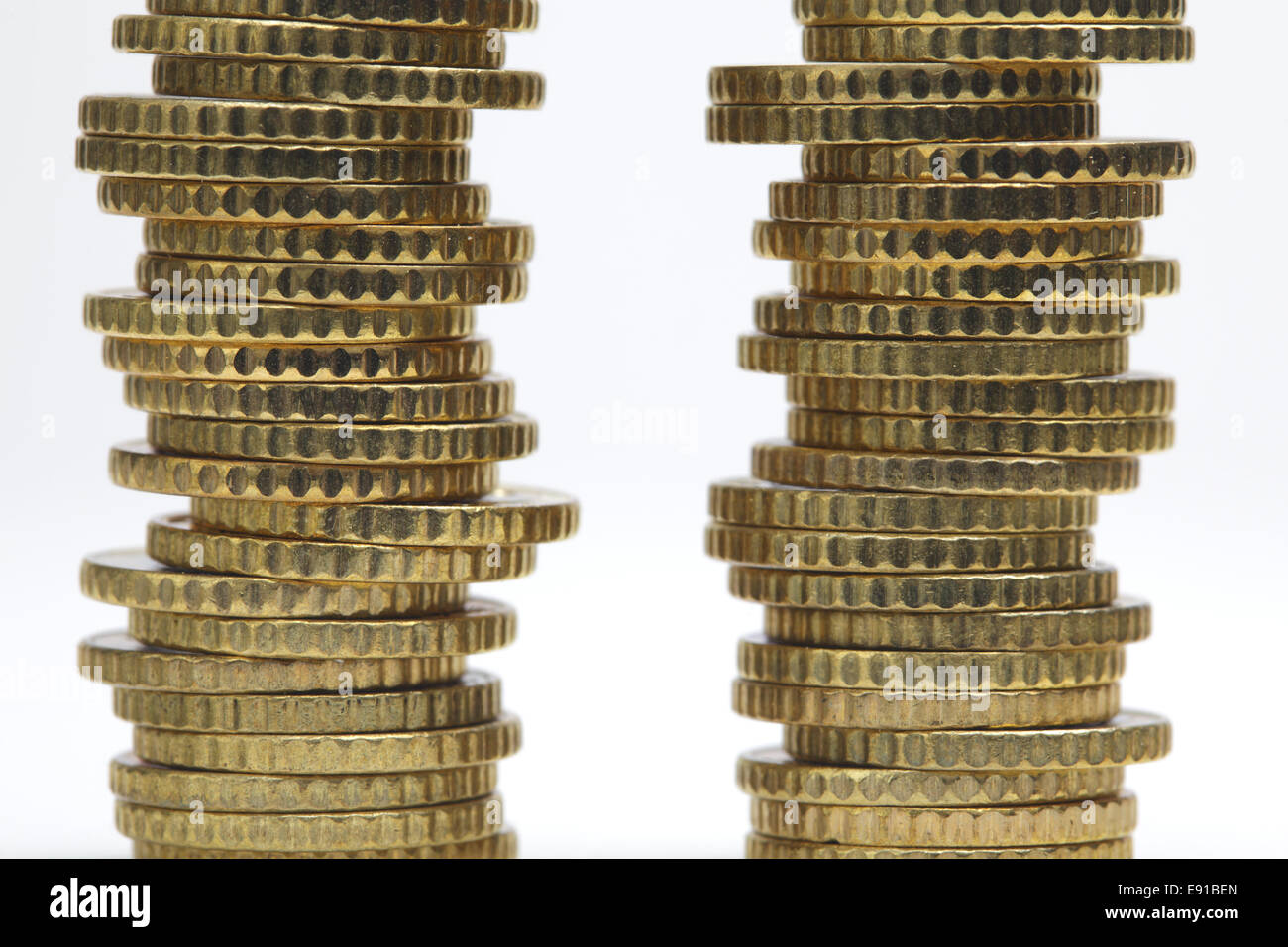 Coin stacks, close-up on white background Stock Photo - Alamy
