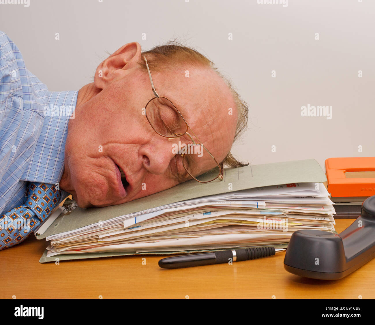 Sleeping in the Office Stock Photo
