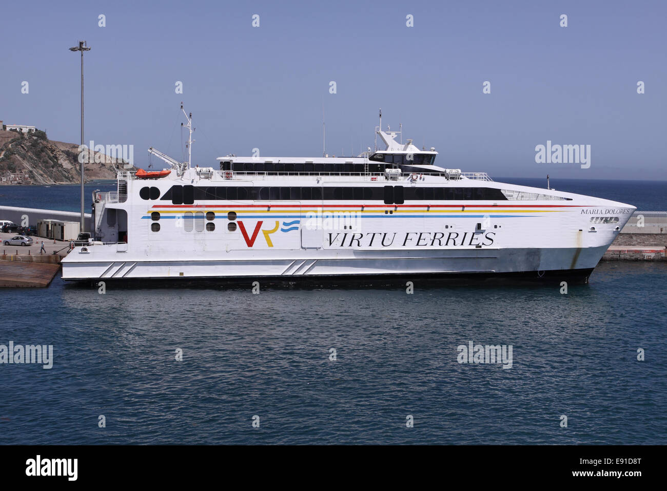 Tarifa Spain harbour port a Virtu Ferries ferry boat  used on passenger services from Spain to Morocco North Africa Stock Photo