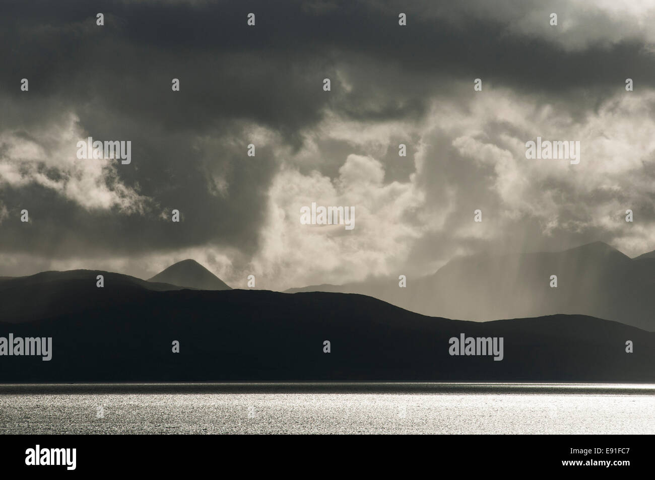 Stormy skies across the sea, among the western Isles of Scotland. Stock Photo
