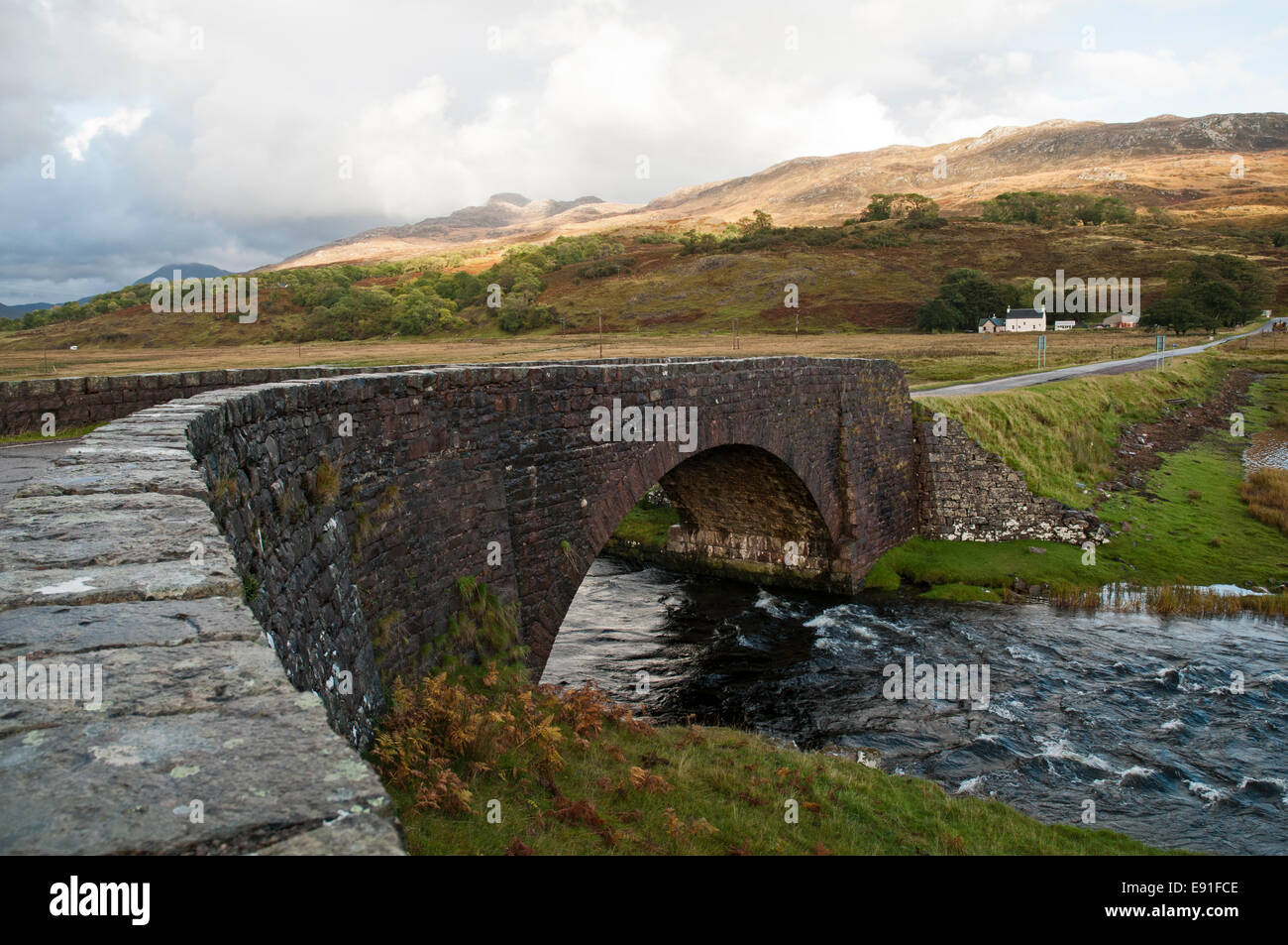 Roadside view by a stone bridge among the hills of western Scotland. Stock Photo