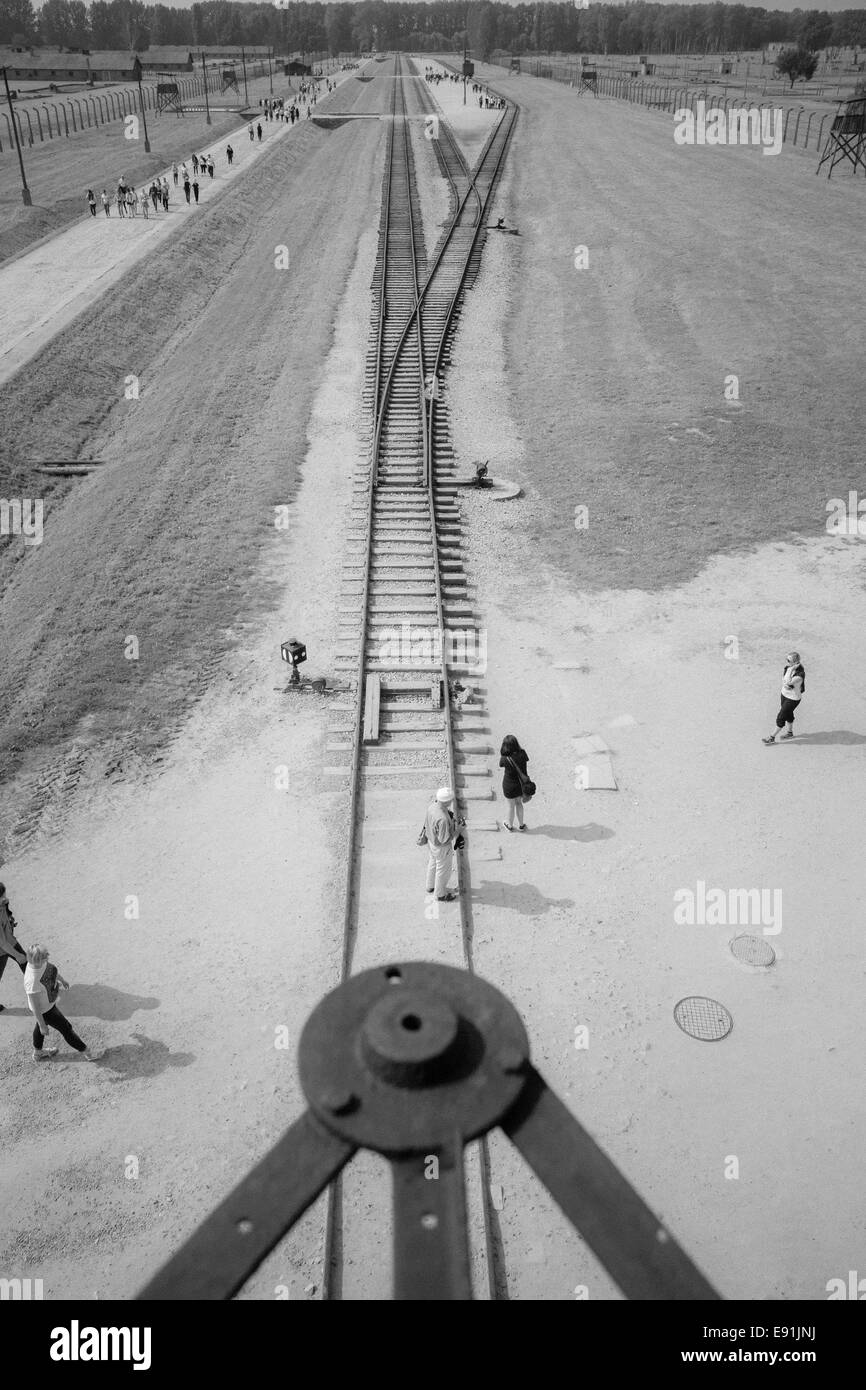 Looking down over rail tracks from the entrance tower at the Auschwitz-Birkenau concentration camp, Auschwitz, Poland - infrared effect Stock Photo