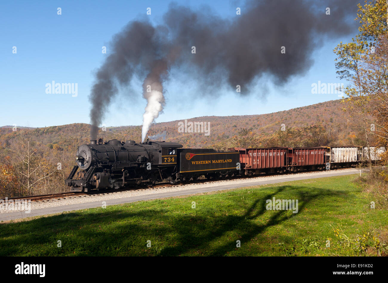 WM Steam train powers along railway Stock Photo