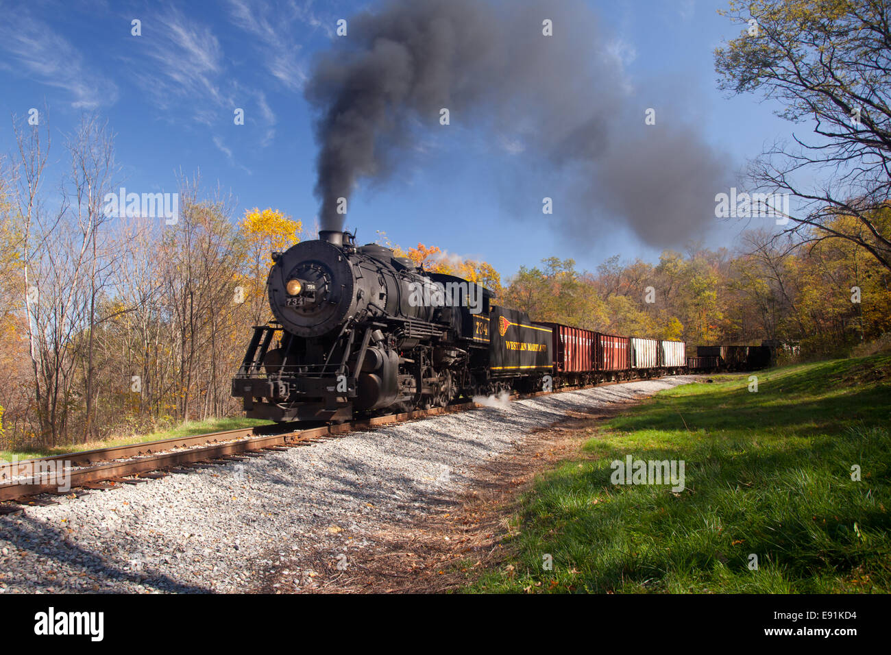 WM Steam train powers along railway Stock Photo
