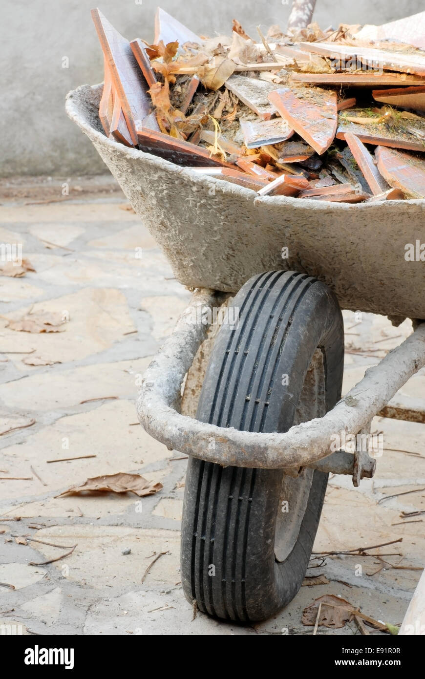 Wheelbarrow with garbage hi res stock photography and images Alamy