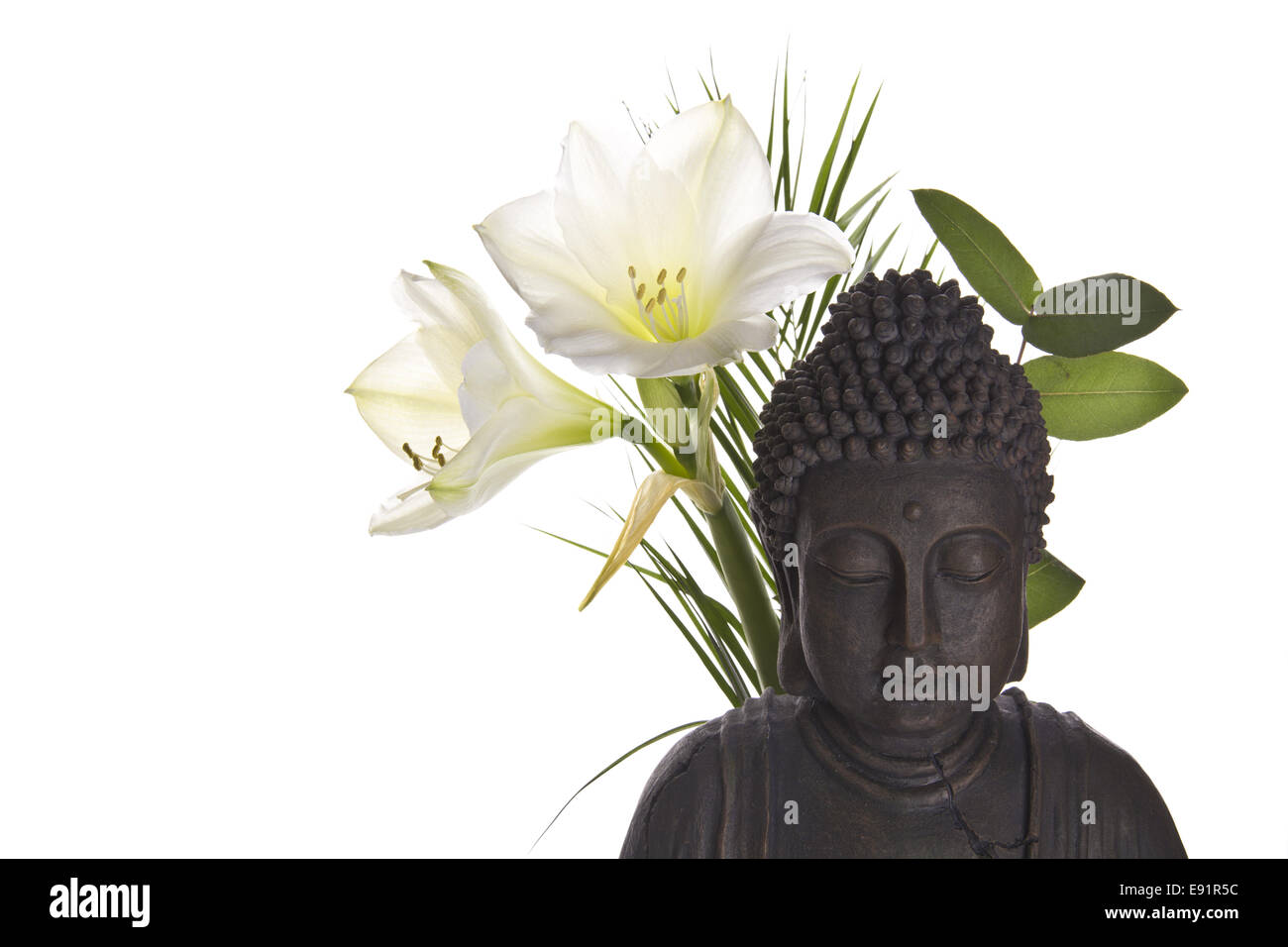 Buddha figure with lily Stock Photo