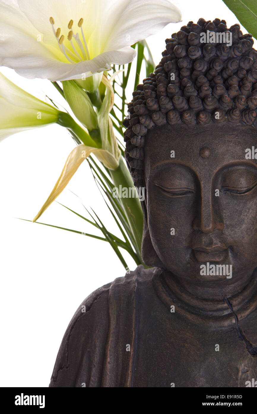 Buddha figure with lily Stock Photo