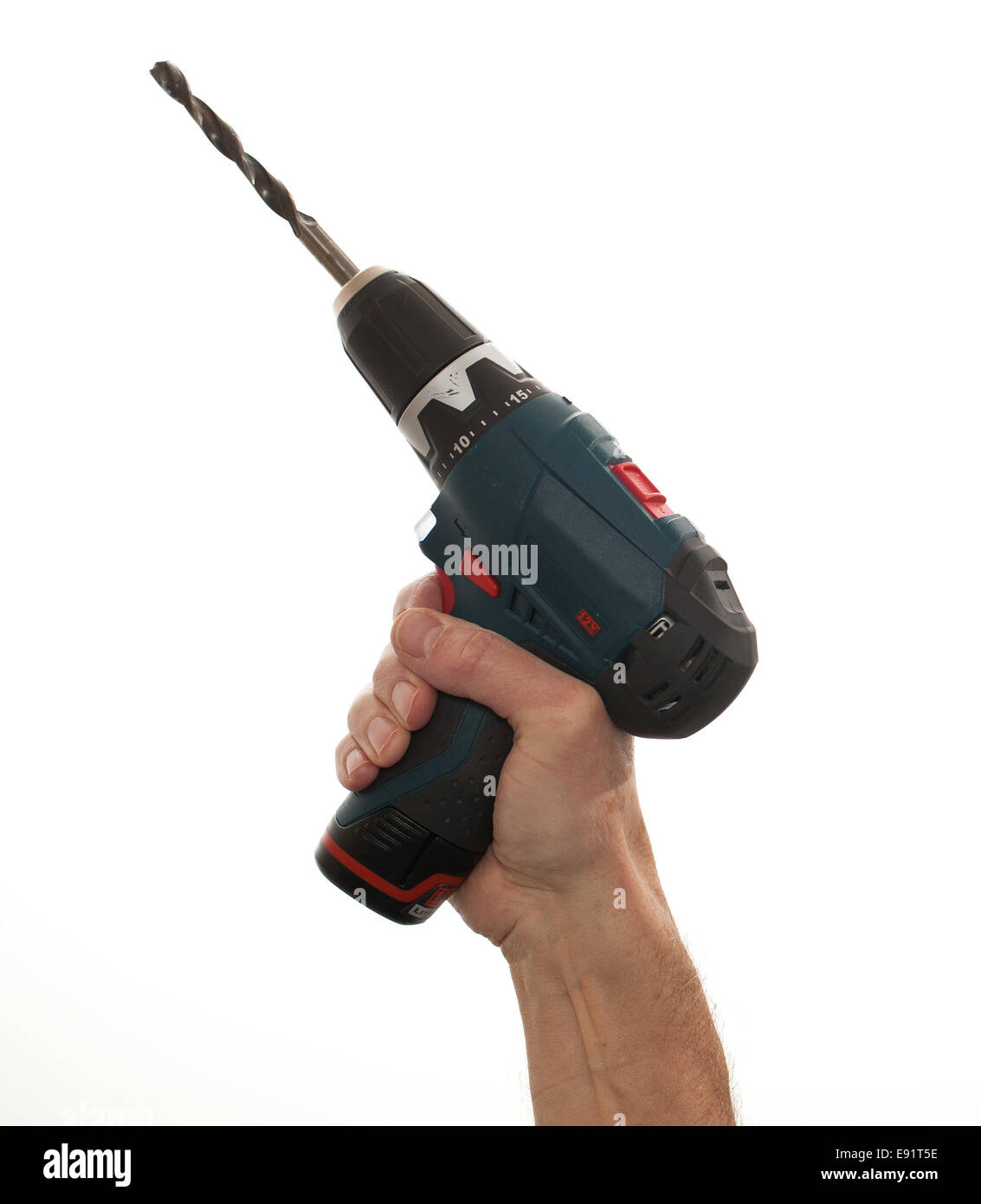 Senior mans arm holding a power drill Stock Photo