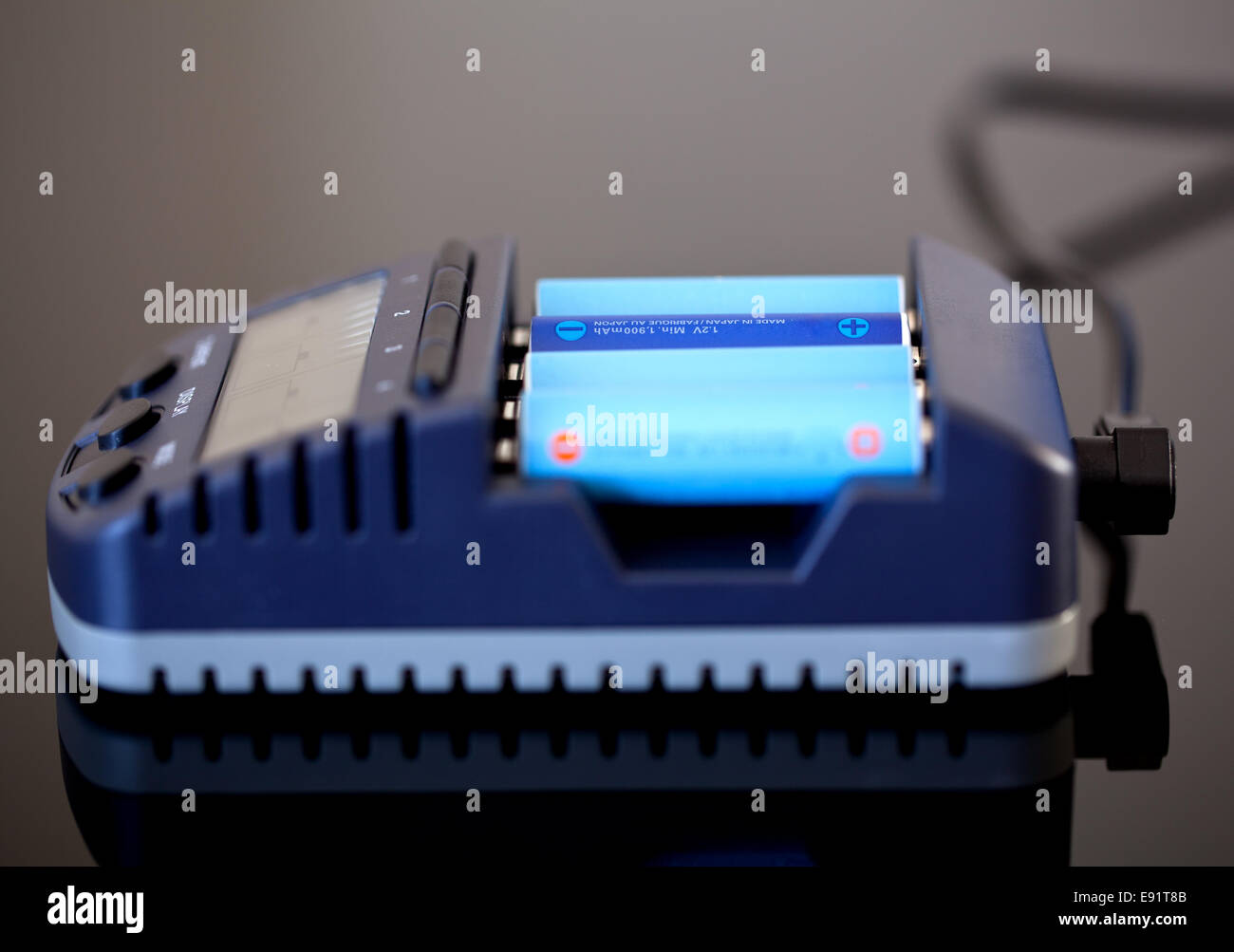 AA battery charger Stock Photo Alamy