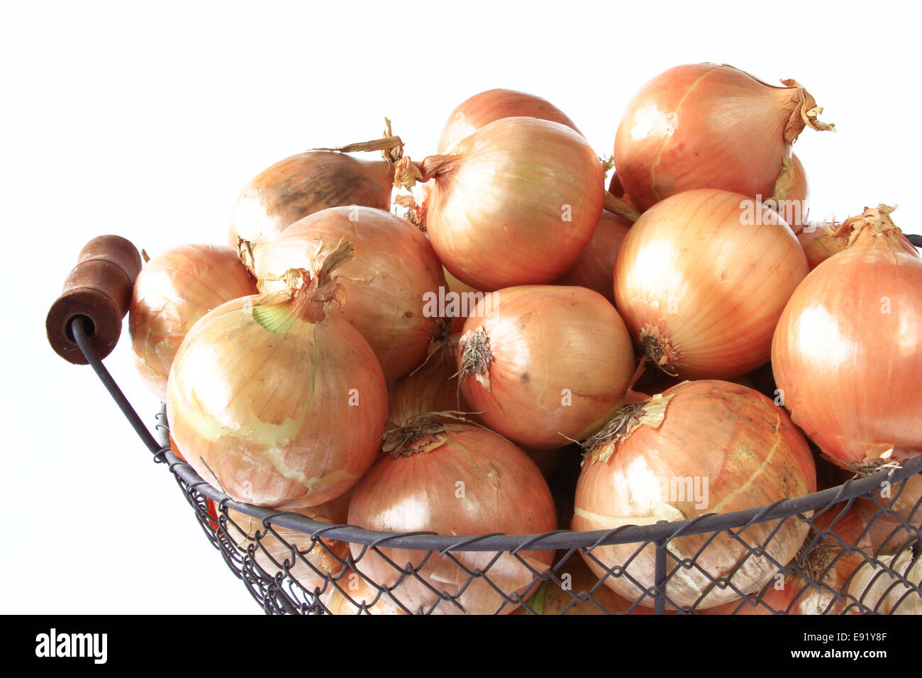 onions in decoratively wire basket Stock Photo Alamy