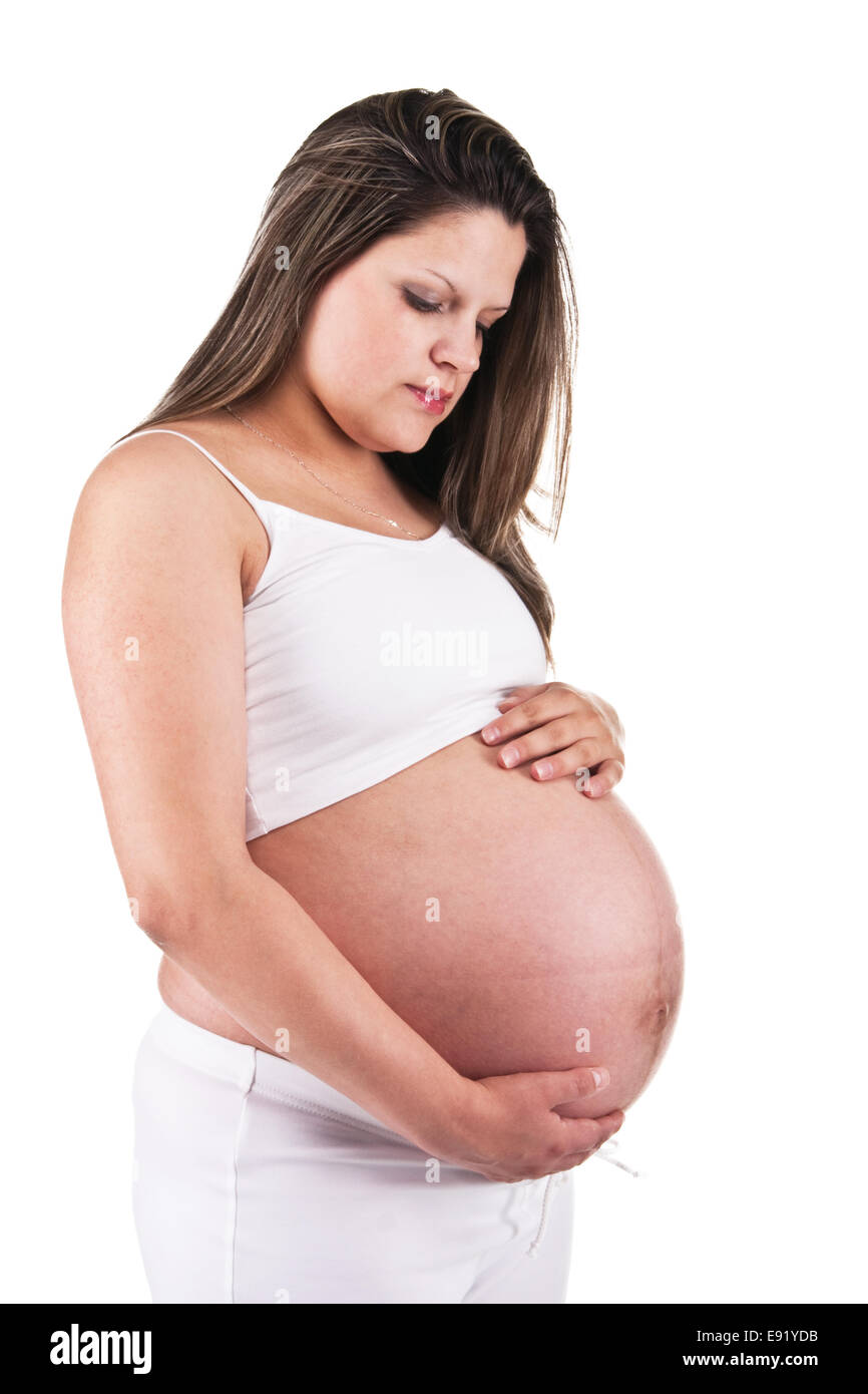 Pregnant woman in white holding her belly Stock Photo - Alamy