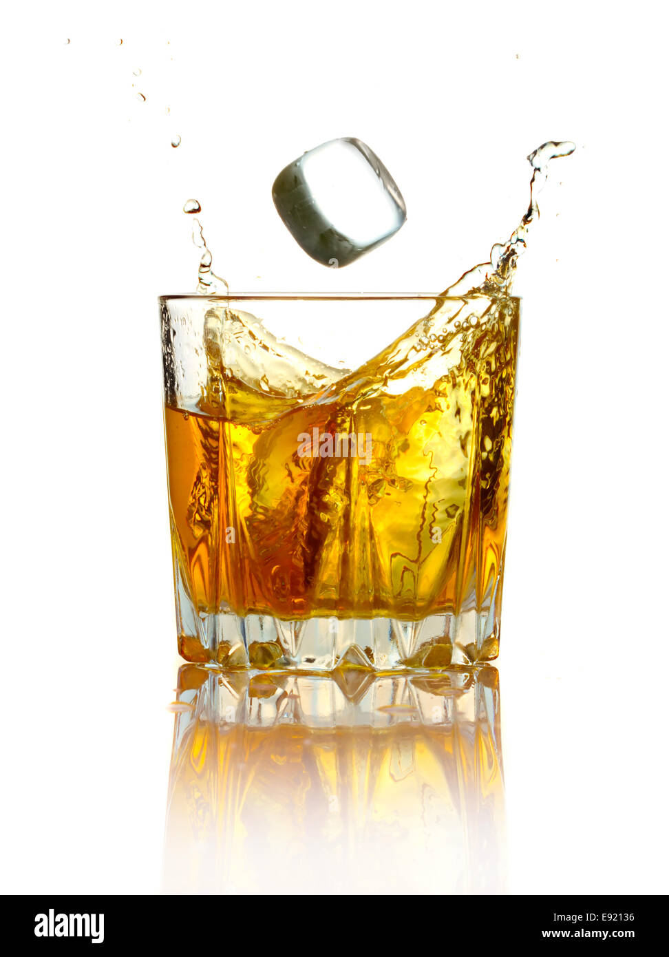 Splash in glass of whiskey and ice isolated, Stock image