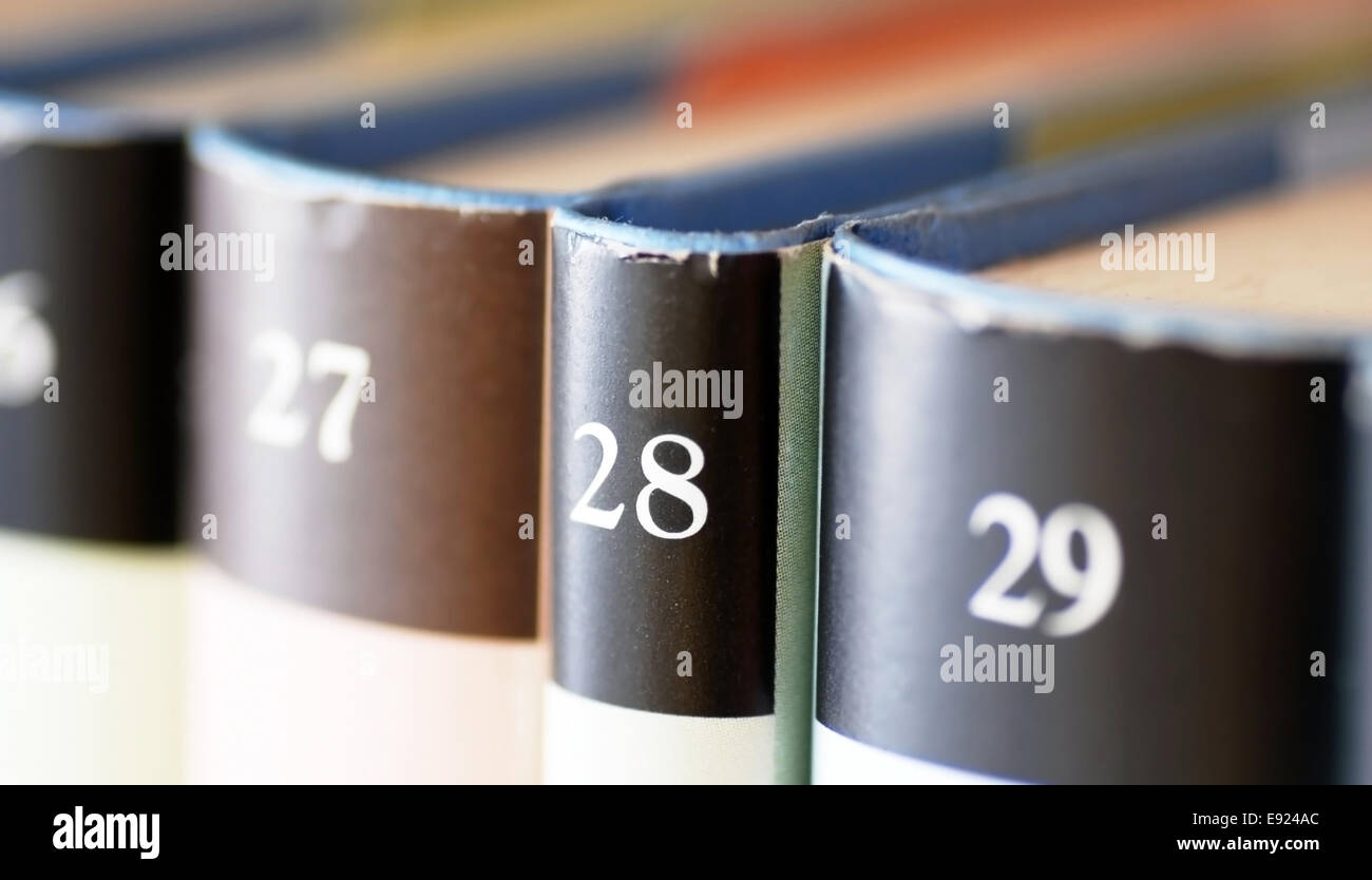 Books volumes row Stock Photo Alamy