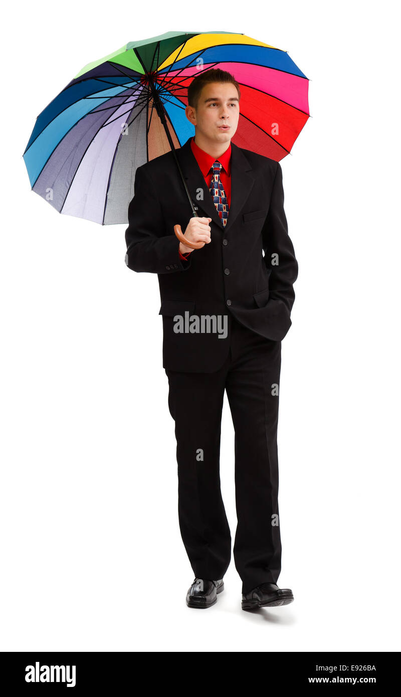 Casual man walking with big colorful umbrella Stock Photo - Alamy