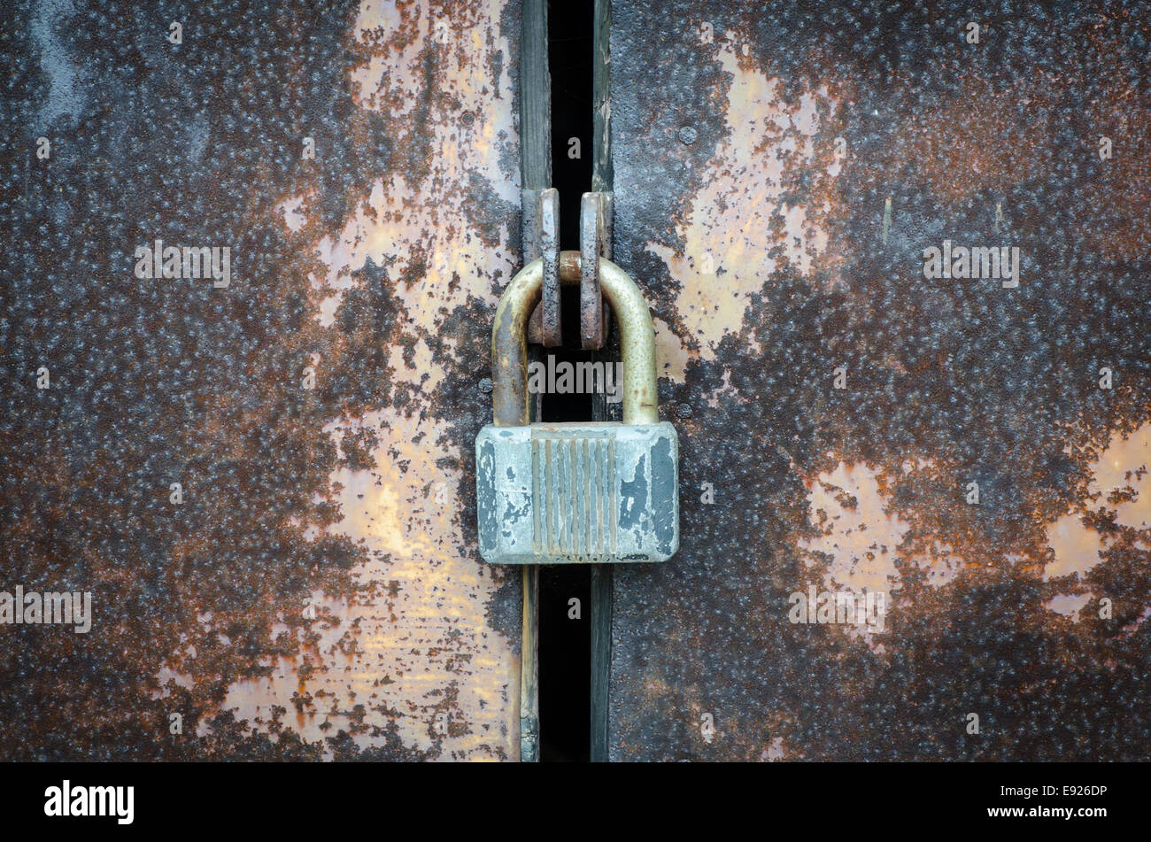 old padlock on metal door Stock Photo Alamy